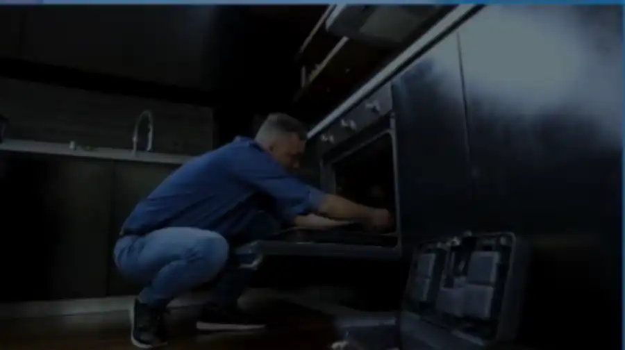 Technician repairing a kitchen oven in Abilene, TX